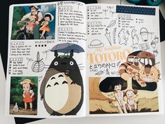 an open book with pictures of people and animals in the pages, including totoro