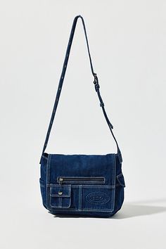 Essential messenger bag crafted from premium BDG denim. Low-profile silhouette with a pocketed flap closure. Lined interior with two pockets and plenty of space for your essentials. Complete with a zip pocket at the back for easy access, plus a water bottle pocket at the side. Finished with an adjustable strap - wear it on your shoulder or crossbody. Urban Outfitters exclusive. Features BDG denim messenger bag Washed soft denim with tons of storage Plenty of pockets inside and out Water bottle p Denim Messenger Bag, Jean Bag, Profile Silhouette, Elevated Basics, Raw Denim, Easy Access, Low Profile, Inside Pocket, Birthday Ideas