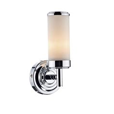 a chrome wall light with a white glass shade