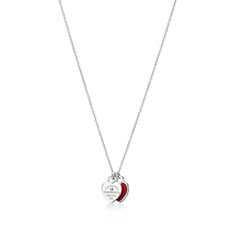 Inspired by a key ring we debuted in 1969, the Return to Tiffany collection is famous for its signature motif. This sterling silver pendant features a pair of the iconic mini heart tags suspended from a fine link chain. One tag is set with a round brilliant diamond; the other tag features a red enamel finish for a playful pop of color. Style with other delicate necklaces or contrast with bold chain jewelry for an unexpected look.This item can be personalized. For more information, call 800 843 3 Red Heart Tiffany Necklace, Tiffany Double Heart Necklace Red, Red Tiffany Necklace, Tiffany & Co, Colar Tiffany E Co, Tiffany And Co Heart Necklace, Tiffany Heart Necklace, Return To Tiffany Necklace, Heart Necklace Tiffany