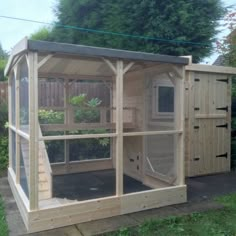 a small wooden structure in the yard