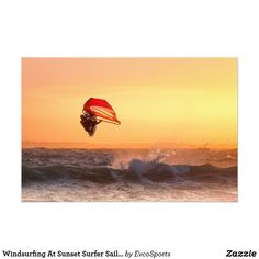 a person on a surfboard in the air over water at sunset or sunrise with waves