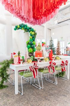 the table is decorated with red, green and white decorations