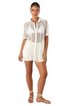 Intricate lace and an oversized fit lends summery charm to this sheer short-sleeve button-up. Front button closure Spread collar Short sleeves Sheer 100% cotton Hand wash, dry flat Imported Chic Short Sleeve Blouse With Scalloped Lace, Chic Scalloped Lace Short Sleeve Blouse, Sheer Short Sleeve Summer Top, Casual Lace Blouse For Summer, Casual Summer Lace Blouse, Collared Lace Tops For Summer, Chic Short Sleeve Cover-up For Beach Season, Short Sleeve Beachwear Cover-up For Daywear, Casual Lace Blouse With Short Sleeves