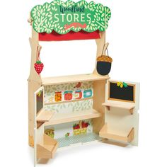 a wooden toy store with shelves and chalkboard on the front, including an apple tree