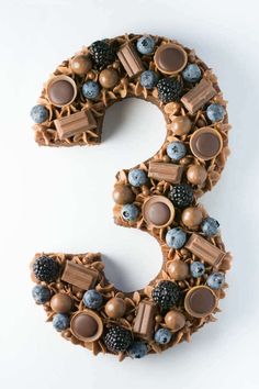 the number 3 made out of chocolate and blueberries