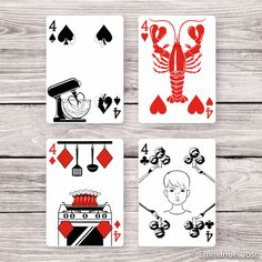 four playing cards with different designs on them