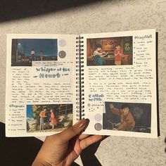 someone is holding up an open book with pictures on the pages and writing in it