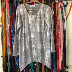 Sale India Boutique 3/4 Sleeve Tunic Style Top Silver - Free Size One Size Nwt. Make A Statement In This Tunic With A Metallic Print And Dramatic Handkerchief Hemjust Add Your Favorite Jeans And Boots For Effortless Evening Style. Three-Quarter Sleeves. Swing Silhouette 32" Longest Length Poly/Spandex Machine Wash Imported 1-10 Casual Long Sleeve Metallic Top, Silver Long Sleeve Tops For Spring, Silver Long Sleeve Top For Summer, Evening Style, Tunic Style Tops, Metallic Prints, Tunic Style, Boutique Tops, Tunic Styles