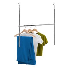 two shirts hanging on a clothes rack and one is green, white and blue in color