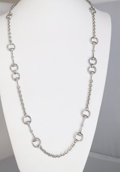 This silver chain necklace is a classic. It's a great everyday piece that you can wear with anything. The chain is made of sterling silver, which is a durable metal that will last for years. The necklace is also adjustable, so you can customize the length to suit your personal style. Long Silver Chain Necklace, Formal Metal Chain Necklace With Adjustable Chain, Formal Metal Chain Necklace, Metal Collar Chain Necklace With Oval Links, Formal Long Metal Chain Necklace, Silver Chain Necklace With Oval Link And Gold Chain, Elegant Silver Jewelry With Chain Strap, Metal Long Necklace With Silver Chain For Gifts, Elegant Silver Necklace With Gold Chain