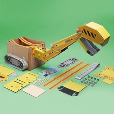 a yellow construction vehicle with tools laid out next to it on a green background,