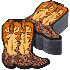 pair of cowboy boots sitting on top of two stacks of coasters, each with an orange and brown design