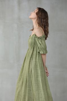 "This linen dress is full of contradictions, ensuring an eye-catching finish. The classic flared structure is contrasted by a slip design, whilst the ruffled details are given a contemporary twist with their asymmetric placement. In a moss green hue, this flared gown is here to turn heads at every event it attends. Off you go. 【Fabric】 95% linen, 5% silk it is Italian linen. exquisite high end texture. we add 5% silk to make it soft and exquisite. lightweight but a little sheer. looks gorgeous. Green Linen Bridesmaid Dress, Green Summer Dress With Straight Neckline, Green Linen Bohemian Dress, Bohemian Green Linen Dress, Green Bohemian Linen Dress, Green Bohemian Dress With Square Neck, Green Square Neck Bohemian Dress, Green Bohemian Square Neck Dress, Summer Off-shoulder Linen Dress