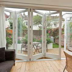 a living room filled with furniture and sliding glass doors