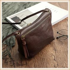 Handbags Type: Shoulder Bags Types of bags: Shoulder & Crossbody Bags Main Material: Genuine Leather Shape: Hobos Gender: WOMEN Closure Type: zipper Hardness: SOFT Pattern Type: Solid Exterior: none Number of Handles/Straps: Single Item Type: Handbags