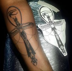 a person with a tattoo on their arm and an image of a cross in the background