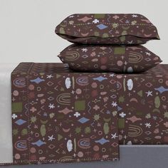 three pillows are stacked on top of each other