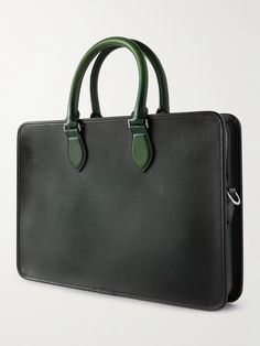 Berluti’s briefcase is made from panels of green Venezia and black 'Scritto' leather for a subtle but effective two-tone look. It's fitted with a front sleeve and zipped pockets to neatly organise your essentials for ease of access on the go. Classic Green Briefcase For Everyday Use, Green Leather Business Bag, Green Rectangular Leather Briefcase, Green Leather Rectangular Briefcase, Classic Green Business Bag, Green Leather Rectangular Case Bag, Modern Green Rectangular Briefcase, Leather Briefcase Men, New Bottega