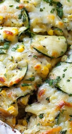 a casserole dish with zucchini, corn and cheese