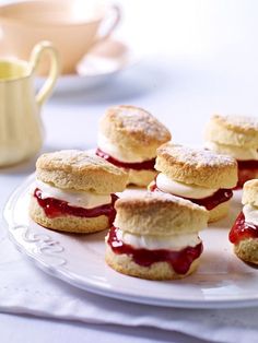 scones with jam and cream on a white plate