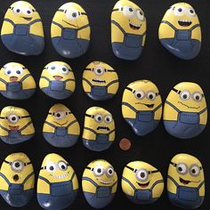 several yellow and blue minion rocks with faces on them