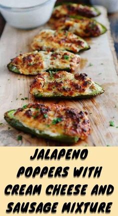 jalapeno poppers with cream cheese and sausage mixture on a cutting board