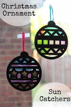 two ornaments hanging from a window with the words christmas ornament on them