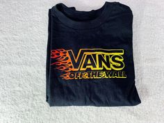 VANS Off the Wall Black Short Sleeve T Shirt Boys Size 5/ Medium New With Tags. Black Casual Vans Top, Black Crew Neck T-shirt By Vans, Black Crew Neck Vans Top, Black Vans Crew Neck Top, Vans Black Tops With Graphic Print, Black Vans Tops With Graphic Print, Vans Black Top With Graphic Print, Vans Black Graphic Tee, Vans Black Crew Neck T-shirt