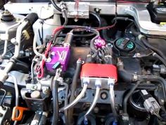 the engine compartment of a car with many wires