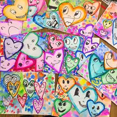 many hearts are drawn on colored paper