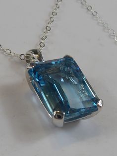 Fine Silver Large Emerald Cut Blue Topaz Pendant Necklace - Etsy Blue Rectangular Topaz Jewelry, Blue Rectangular Faceted Jewelry, Radiant Cut Blue Topaz Jewelry, Blue Topaz Square Cut Jewelry, Blue Aquamarine Jewelry With Rectangular Stone, Square Cut Blue Topaz Jewelry, Blue Square Cut Blue Topaz Jewelry, Blue Rectangular Necklace For Anniversary, Blue Topaz Jewelry With Square Cut For Gifts