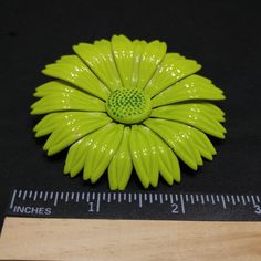 "*Description: This is a great 1960s large enamel flower brooch in light green enamel over copper tone metal with a darker green textured center and a rolling c clasp on a v rivet. These flowers were very popular in the \"Flower Power\" 1960s. This would be a great brooch for a jacket, hat, or bag. This would be a great addition to your vintage jewelry collection or make a great vintage gift! *Approximate Measurements: Length & Width - 3 Inches, Weight - .9 Ounce *Condition: Very good vintag Spring Green Brooch Gift, Green Spring Brooches As Gifts, Green Spring Brooches Perfect As A Gift, Green Spring Gift Brooches, Green Flower-shaped Enamel Brooch Pin, Green Flower Shaped Enamel Pin Brooch, Green Flower Enamel Pin Brooch, Mid-century Green Brooch As A Gift, Vintage Green Flower Brooches