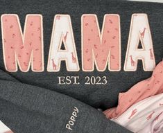 You will love our Custom MAMA, DAD or Grandparents Shirts! Professionally embroidered on soft and comfortable sweatshirts or T-shirts. Paired with your children's clothing, these are a great keepsake.  CUSTOMER IS RESPONSIBLE FOR GETTING BABY/CHILDREN CLOTHING TO ME THAT ARE TO BE USED IN THE APPLIQUE ON THE SWEATSHIRT.  PRICE INCLUDES 2 NAMES ON THE SLEEVE.   THERE IS AN EXTRA $6 CHARGE  FOR 3-4 NAMES. $10 FOR ANYTHING ABOVE 4 NAMES.  PLEASE USE SLEEVE ADD-ON 3-4 sleeve https://www.etsy.com/lis Grandparents Shirts, Grandparents Shirt, Mama Sweatshirt, Sweat Shirts, Children Clothing, Personalized Embroidered, Embroidered Shirt, Customized Gifts, Childrens Clothes