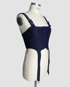 handmade upcycled 'IDA' corset in dark blue. MEASUREMENTS: measurements are only the fabric! you can adjust the size with the ribbons!! size tipp for corset: go smaller than your own measurements!!  corset:  bust circumference: 75cm taille circumference: 65cm length: 20cm i washed the fabric but to make sure you are not allergic to the laundry detergent i use, i would recommend you to wash it before you wear it. if you have questions about my products feel free to dm me on insta: allinabasement Fitted Party Corset With Tie Straps, Fitted Corset Belt With Adjustable Straps For Night Out, Blue Corset Dress With Corset Back For Night Out, Blue Underbust Corset Dress For Party, Blue Sleeveless Corset With Straps, Blue Overbust Corset For Party, Blue Corset With Straps, Fitted Blue Corset For Night Out, Blue Fitted Corset With Corset Back