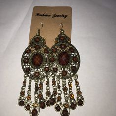 Bohemian Gold Tone Earrings Elegant Brown Chandelier Earrings, Bohemian Brown Chandelier Earrings With Dangling Beads, Brown Bohemian Dangle Earrings, Bohemian Brown Pierced Earrings, Nickel-free Brown Bohemian Earrings, Bohemian Teardrop Crystal Earrings, Bohemian Teardrop Crystal Earrings For Pierced Ears, Vintage Brown Earrings For Festivals, Bohemian Brown Drop Chandelier Earrings