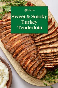 sliced meat and potatoes on a platter with the words sweet & smoky turkey tenderloin