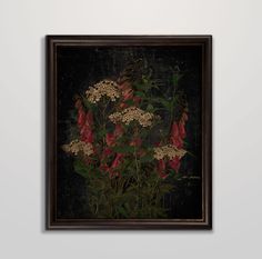 a painting on the wall with flowers and leaves in it's center, against a gray background