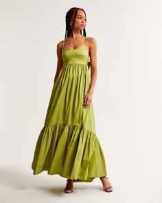 Flattering longer-length maxi dress in our stretchy taffeta fabric with a shiny finish and babydoll silhouette, featuring adjustable straps, bow-back detail and a drama tiered skirt. Taffeta Gown, Green Tights, Popular Costumes, Taffeta Fabric, Wearing All Black, Green Maxi, Bow Back, Maxi Dress Green, Tier Skirt