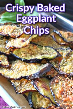 crispy baked eggplant chips on a baking sheet