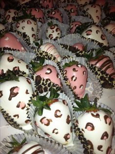 chocolate covered strawberries are arranged in the shape of heart - shaped hearts and decorated with leopard print