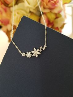 "CZ Necklace, Cubic Flower Necklace, Flower pendant, Spring jewerly/ Flower Girl gift/ everyday jewelry ✦ Pendant cubic zirconia,16K gold plated - Size:30x11mm including links ( flower) ✦ Gold Figaro Chain, Rhodium Figaro Chain ✦ Length: The length is 16\"+2.5\" extender chain ✦ Beautifully gift wrapped in a gift box with a ribbon." Cubic Zirconia Flower Charm Jewelry For Anniversary, Anniversary Flower Necklace With Clavicle Chain, Dainty Diamond White Flower-shaped Jewelry, Flower Shaped Cubic Zirconia Jewelry, Cubic Zirconia Pendant With Flower Charm, Flower Shaped Diamond Jewelry For Gift, Diamond Flower Shape Jewelry For Gift, Diamond Flower Shape Jewelry Gift, Diamond Jewelry In Flower Shape For Gifts