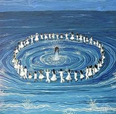 a group of people standing in the middle of a body of water surrounded by circles