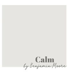 a white wall with the words calm written in black and grey on it, next to a