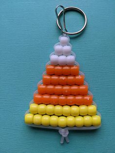 a plastic keychain with candy in the shape of a pyramid