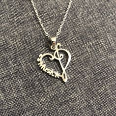 "This music note necklace can be made into necklace, bracelet, earring and more... Please specify your 'name' to be crafted in the order note. Base Material: Sterling Silver Size: 22mm X 28mm Chain Length: 14'' - 24'' Inches Metal Stamped: 925 Thickness: 1.5mm Crafting Time: 7 - 10 working days Durable Plating: Rose Gold or Gold (Selectable with additional fee of USD 10) You'll receive Order Shipped Email from us when your item is completed and shipped. SPECIAL ANNOUNCEMENT 1. Please visit https Heart-shaped Music-themed Jewelry Gift, Music-themed Heart-shaped Jewelry Gift, Silver Heart-shaped Music-themed Jewelry, Music-themed Silver Heart Jewelry, Nickel-free Sterling Silver Music-themed Necklace, Nickel-free Music-themed Jewelry As Gift, Personalized Music-themed Necklaces For Anniversary, Music-themed Jewelry For Valentine's Day Gift, Music-themed Personalized Necklaces For Anniversary