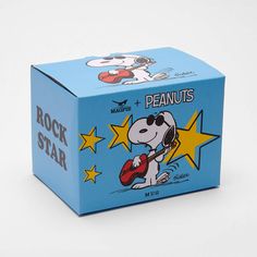 a blue box with a cartoon dog playing the guitar on it's front and side