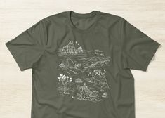 Iconic National Parks hiking and camping casual shirt. Featuring Utah's Bryce Canyon Capitol Reef, and Arches National Parks, Joshua Tree, and Yosemite.  This ultimate t-shirt is made with superior 100% combed ring-spun cotton and pre-washed to prevent shrinking. It has a retail fit and a slightly longer length perfect for tucking into jeans. Customizable, soft and comfy, if you are looking for a socially, ethically and environmentally conscious brand, this is a must have for your store and wardrobe. Green Relaxed Fit Tops For Hiking, Green Cotton Top For Hiking, Graphic Tee For Hiking With Relaxed Fit, Relaxed Fit Screen Print Tops For Outdoor Activities, Cotton Relaxed Fit Top For Hiking, Relaxed Fit Cotton Top For Hiking, Relaxed Cotton Top For Hiking, Graphic Print Relaxed Fit Top For Hiking, Relaxed Fit Graphic Print Top For Hiking