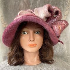 Wet Felted  merino wool and bamboo silk cloche .  Mannequin head size is 21 , will fit 22,-23,5 inches created as one of a kind.Feel free to email me any questions. Thanks. Pink Wide Brim Cloche Hat For Winter, Elegant Felt Cloche Hat For Fall, Pink Fitted Mini Hat For Winter, Fitted Pink Mini Hat For Winter, Elegant Burgundy Hat For Winter, Pink Winter Felt Hat With Short Brim, Pink Short Brim Felt Hat For Winter, Winter Pink Short Brim Felt Hat, Handmade Fitted Winter Mini Hats