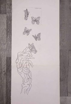 a piece of paper that has some drawings on it with butterflies flying over the top